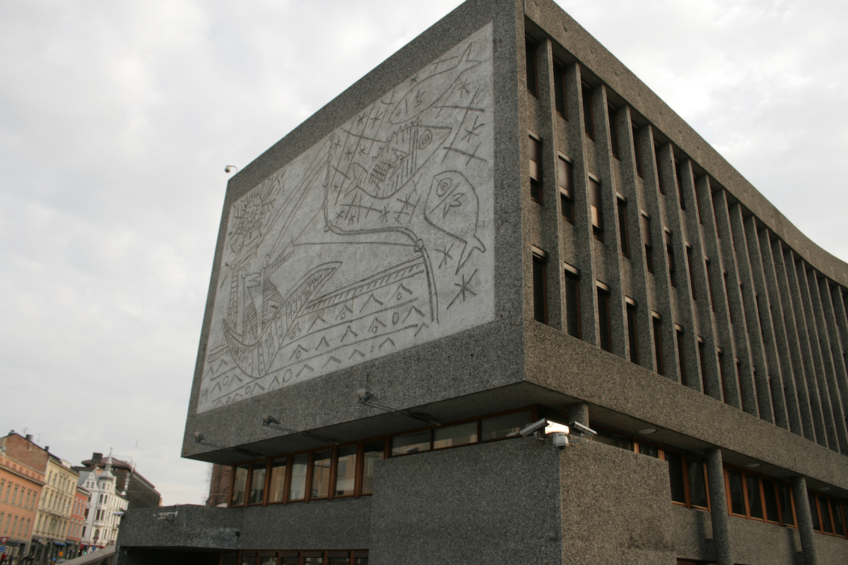 a building with a concrete Picasso mural in oslo