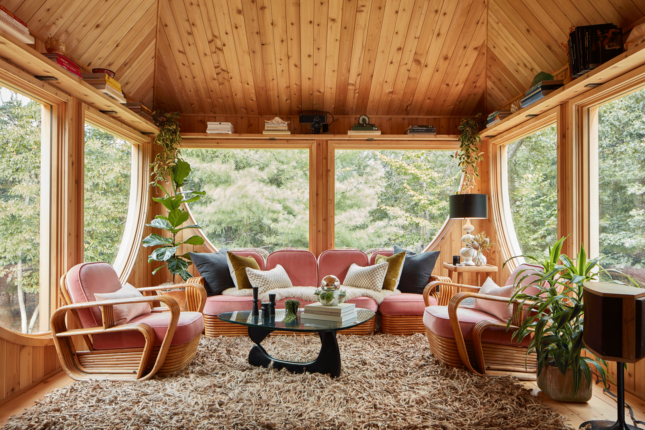 Room with furniture, carpeting and wooden ceiling inside an Andrew Geller-designed home