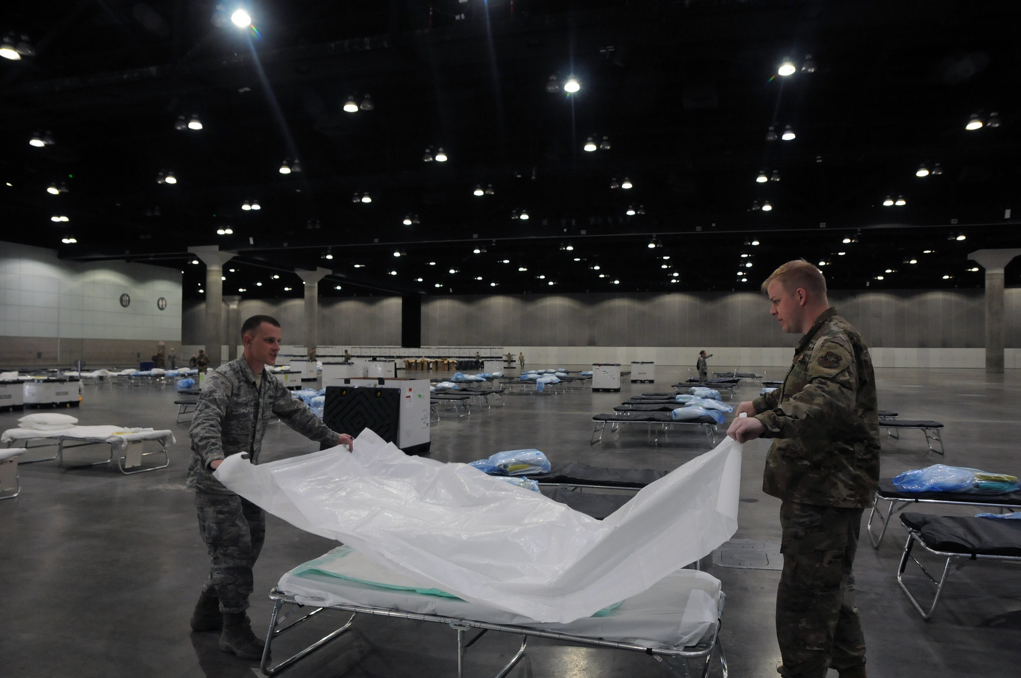 national guard members prepare a hospital bed