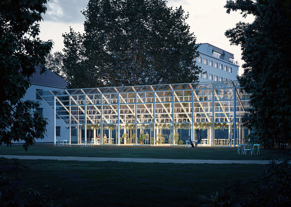 a renovated historic greenhouse pictured at dusk, which will rise on the site of the one where Gregor Mendel conducted his experiments
