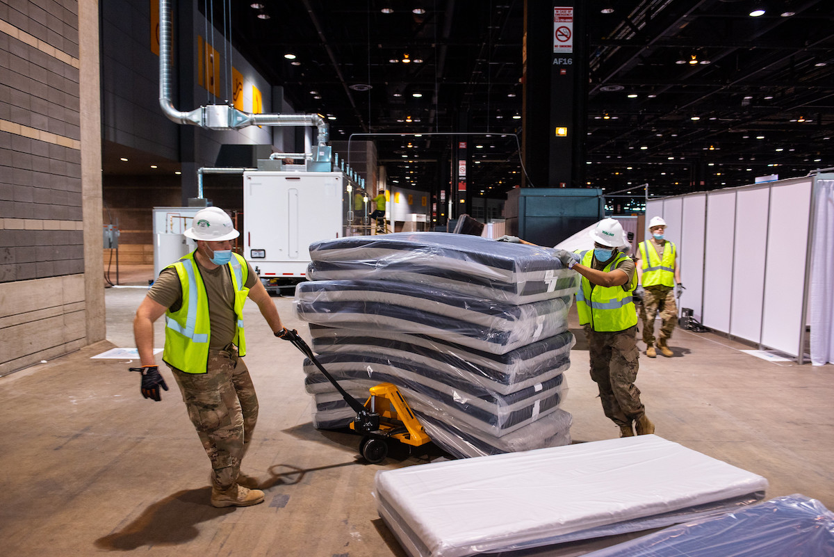 national guard members loading gear into convention center, a project on the COVID-19 ArchMap