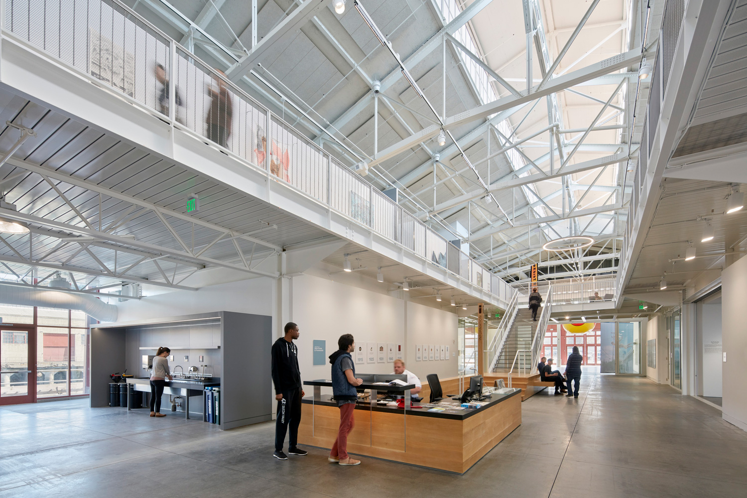 Interior of a converted warehouse with exposed trusses, now a building for the San Francisco Art Institute