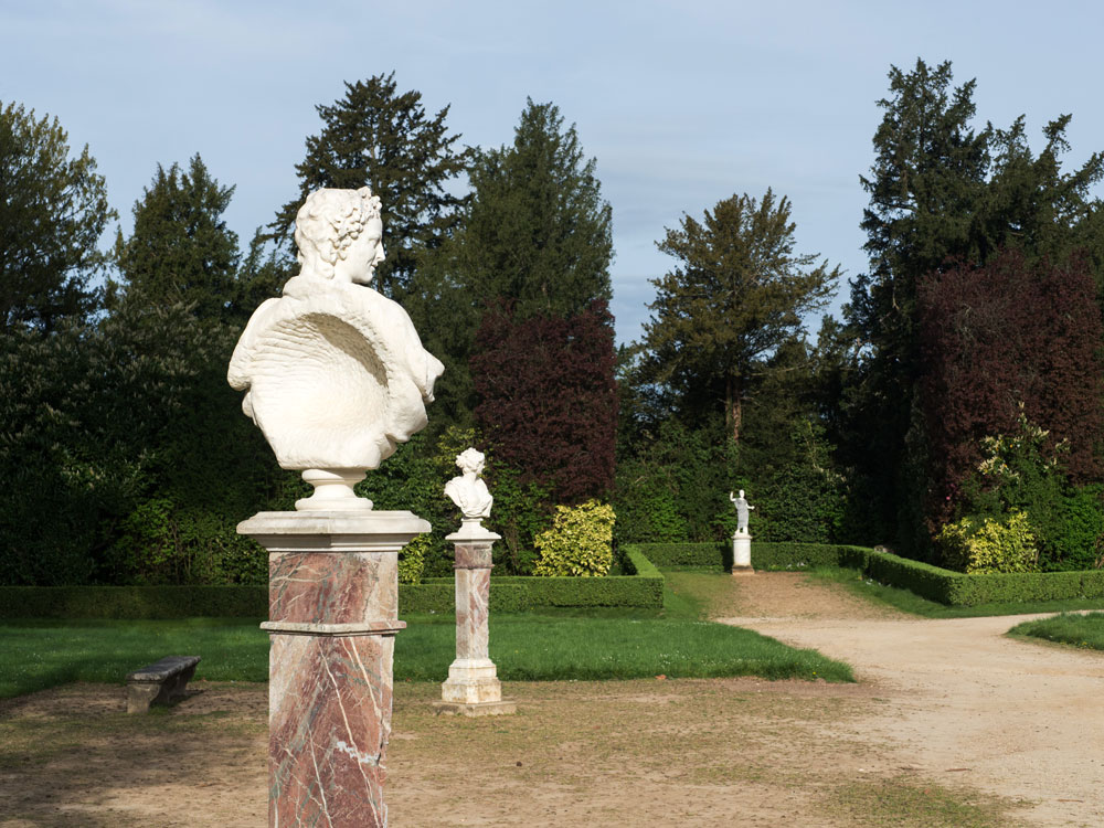 White statues in landscaped park at the Palace of Versailles