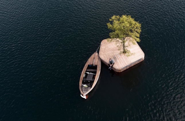 boat next to small wooden island