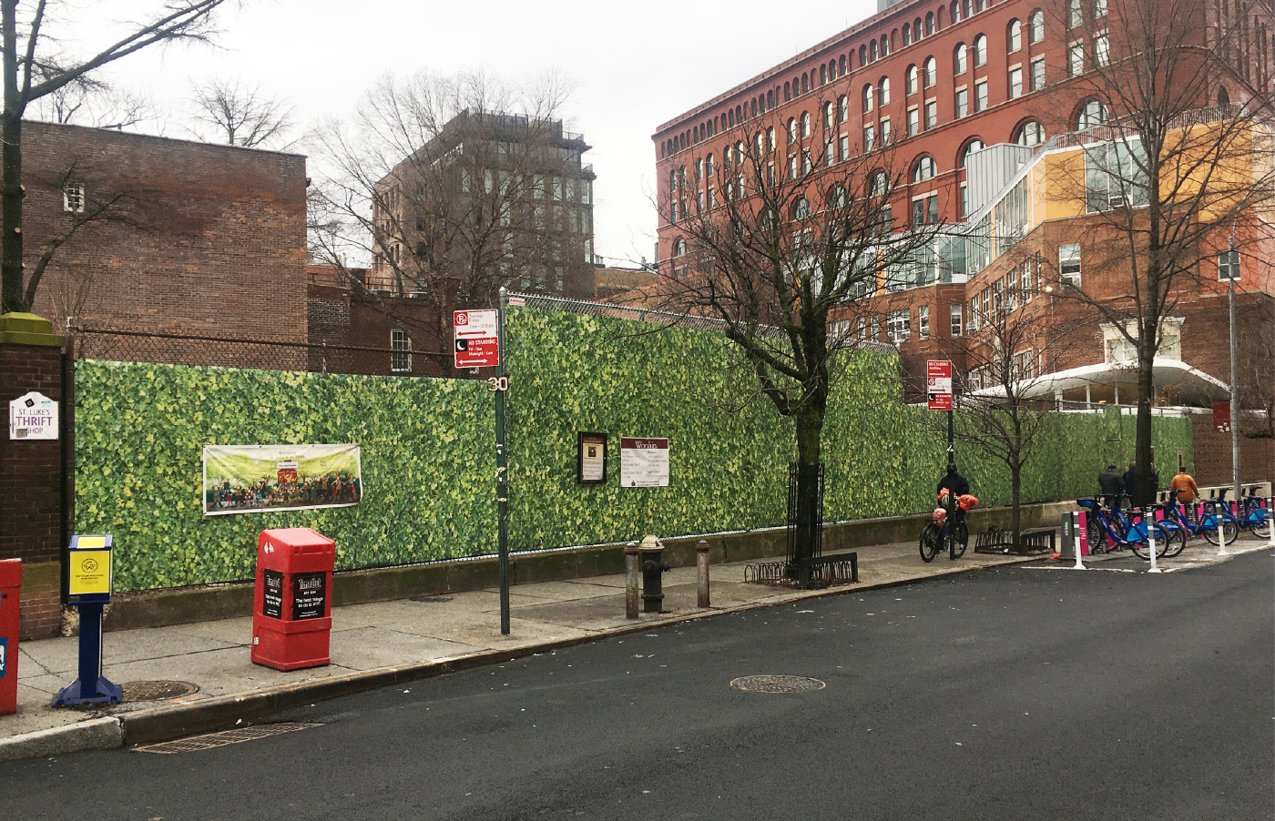 A school playground wrapped in fencing with fake ivy in Greenwich Village