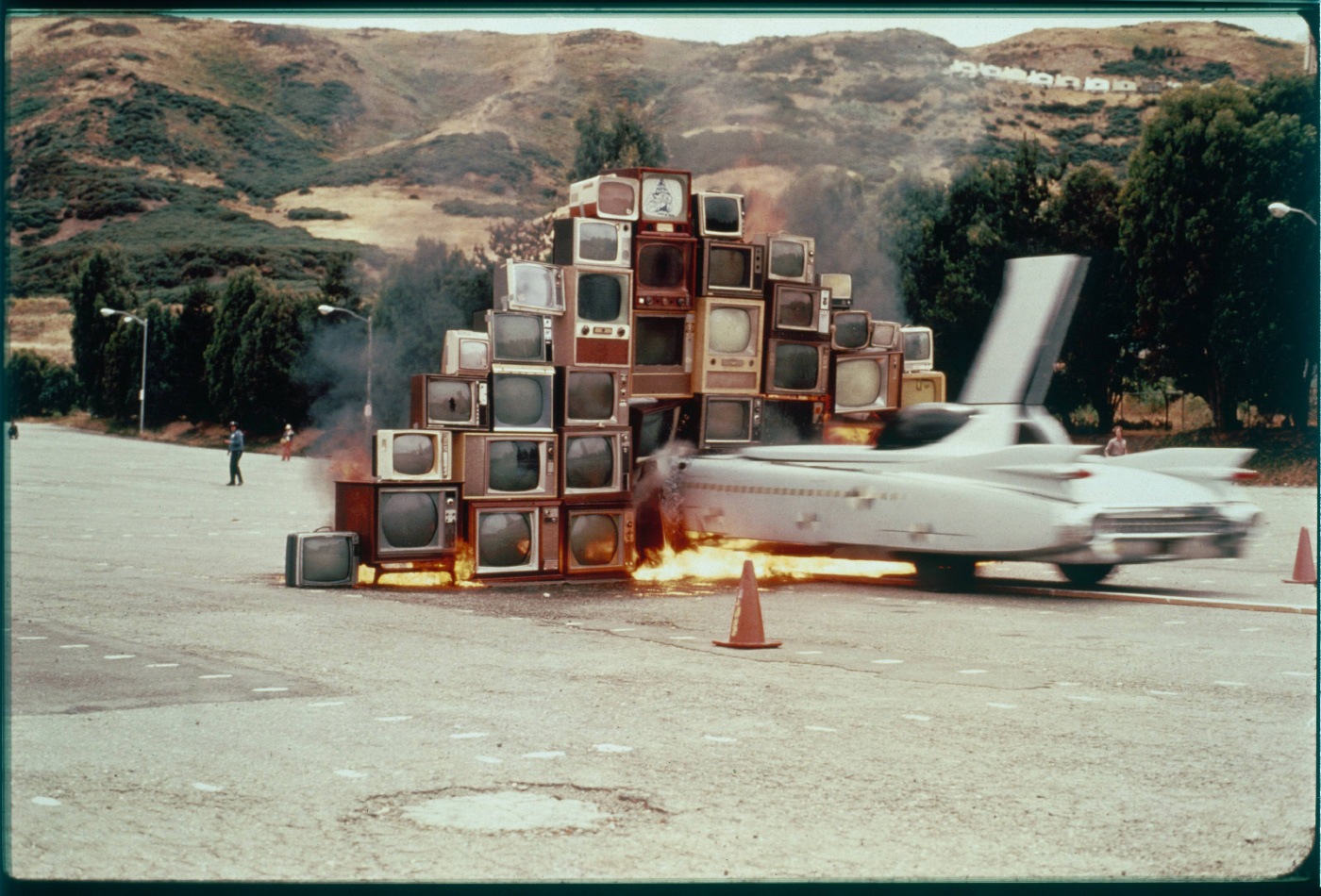 A car driving into a wall of television sets, from Ant Farm, on display at ADFF