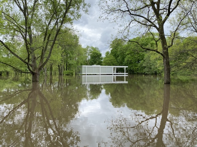 the farnsworth house in illinois surrounded by floodwaters