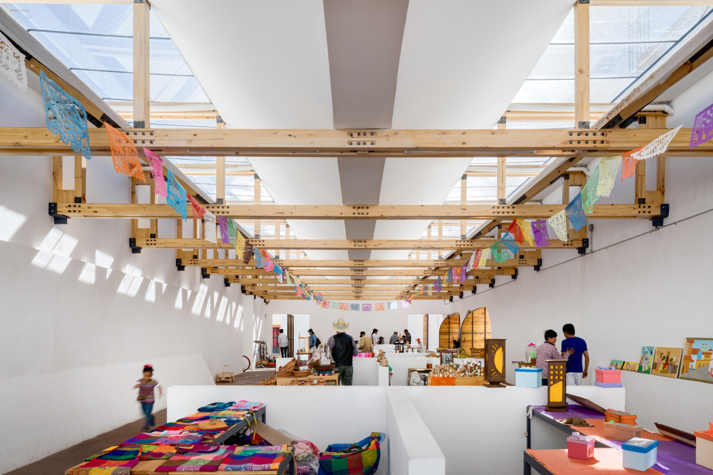 An open-air market hall designed by Architectural League Prize winner Vrtical