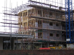 a mass timber-framed apartment building under construction