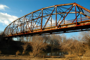A rusted bridge, the type that would be covered by the Moving Forward Act