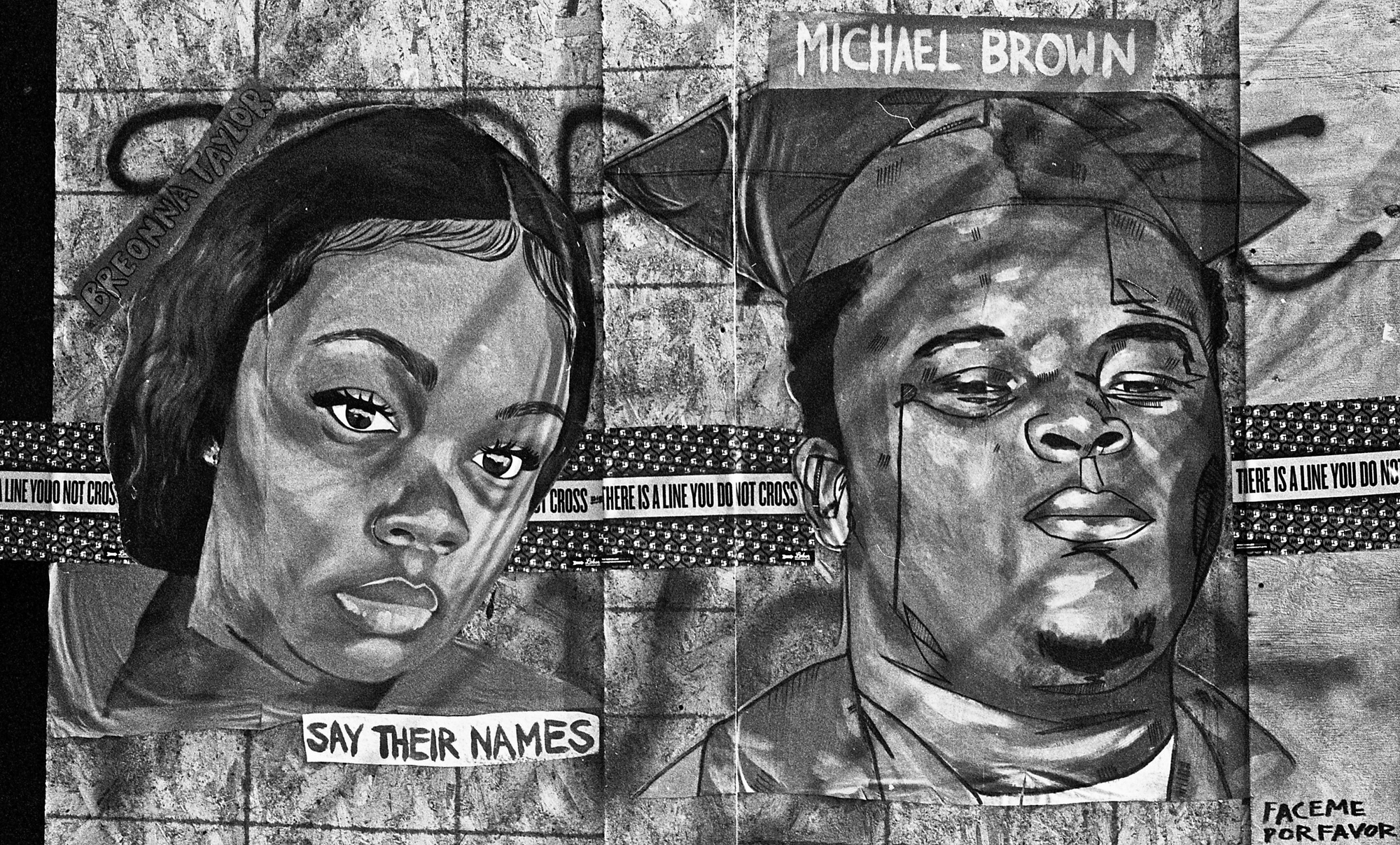 Black-and-white mural of two people killed by police