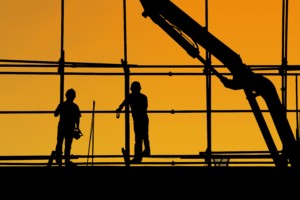 Nonresidential Construction workers at sunset