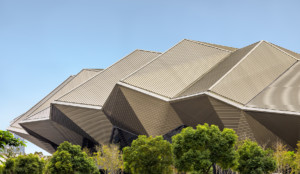 Photo of faceted aluminum facade that makes up the Taipei Music Center