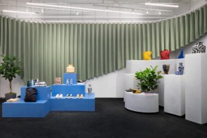 Interior of an ONS store with green rippled curtain by COLLECTIVE