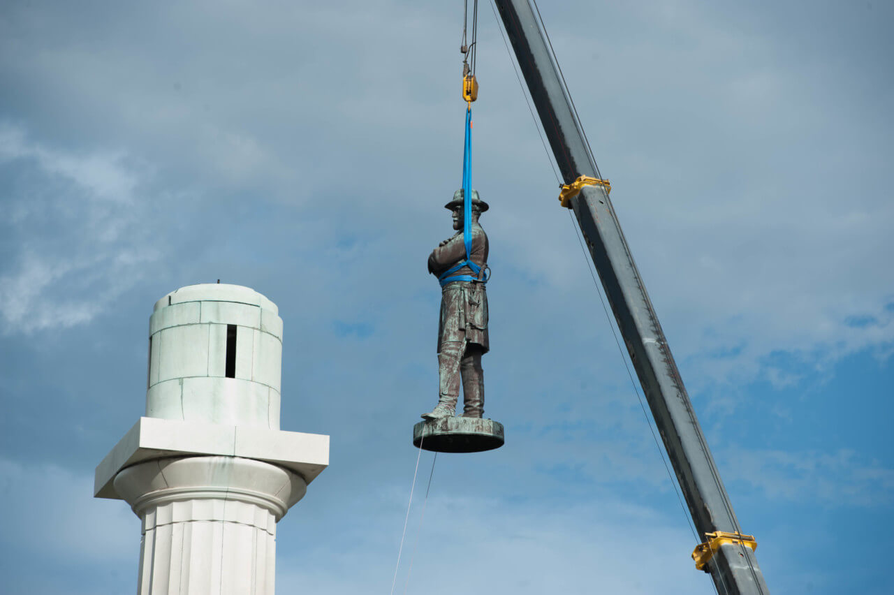 A confederate monument being removed