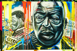 Photo of multicolored mural with John Lewis's face shown from two different ages in his life at murals that matter