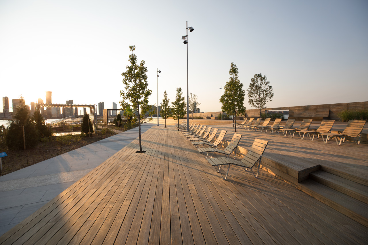 A wooden walkway with benches