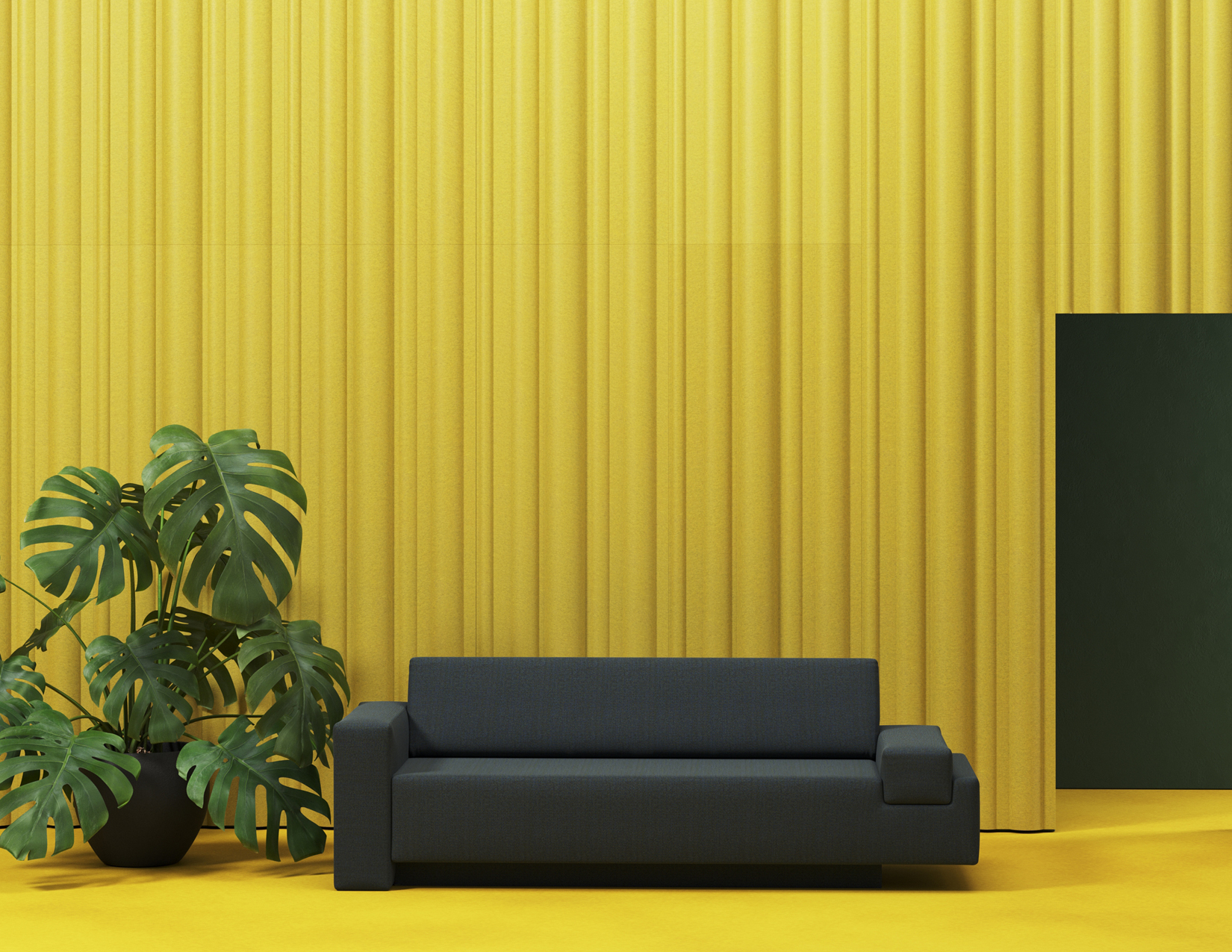 A yellow room with black couch
