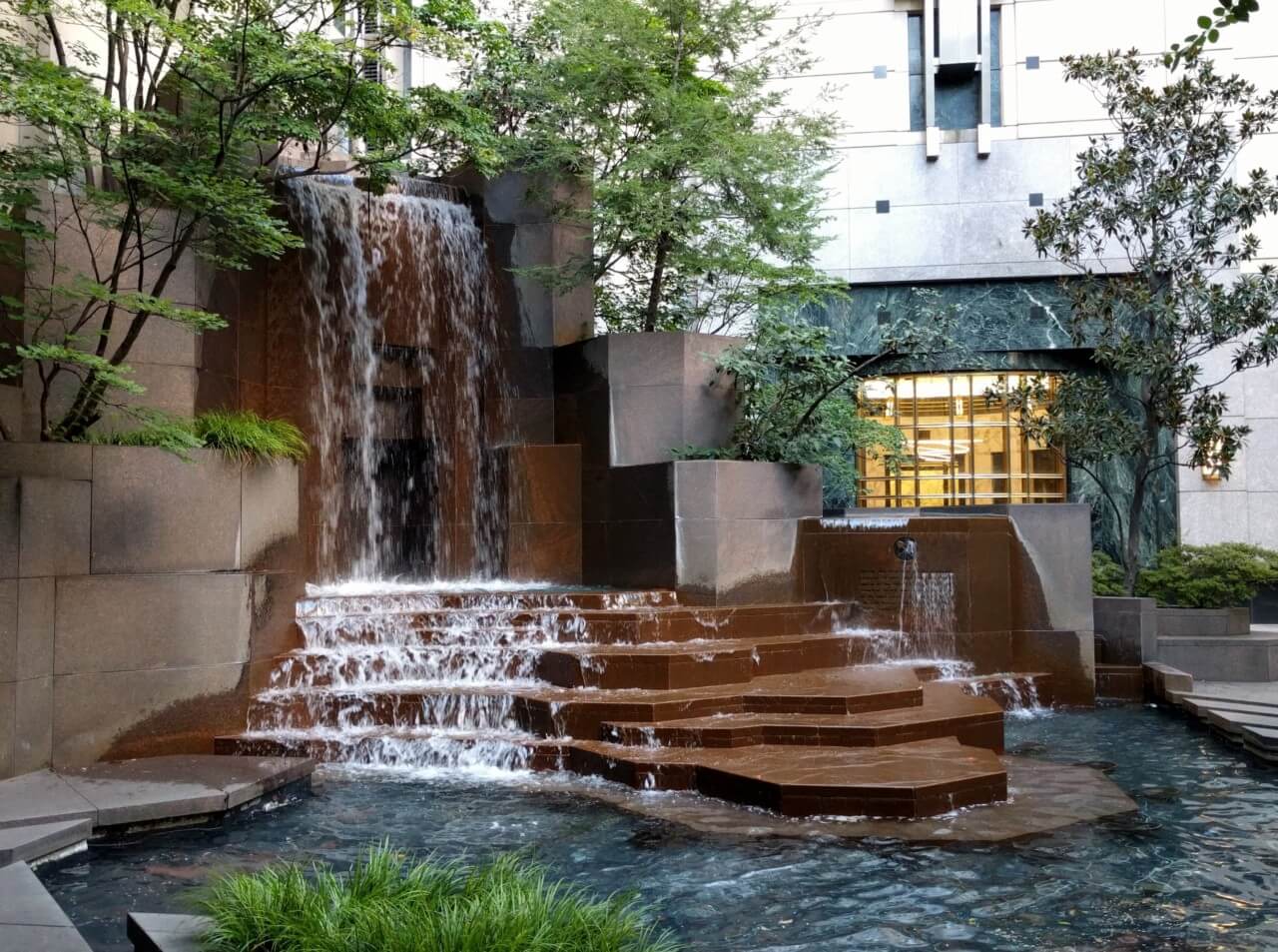 a fountain in an urban park