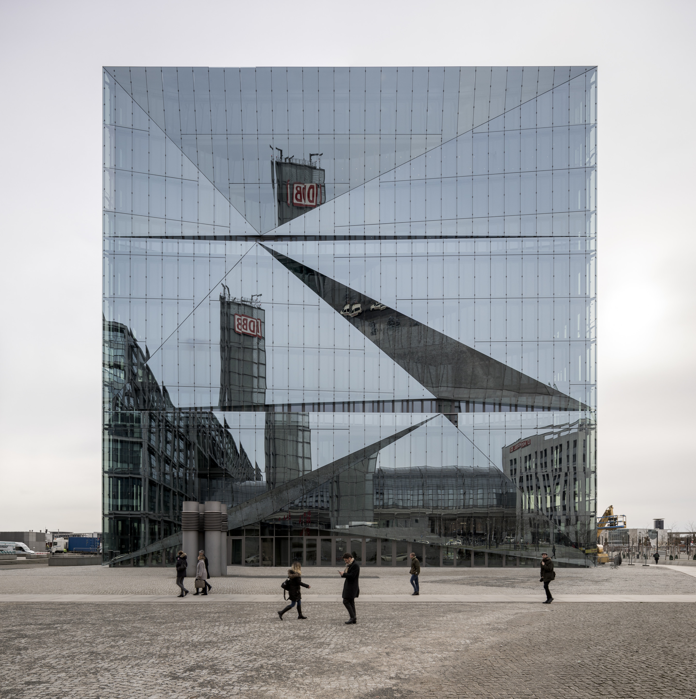 daytime image of cube berlin with passing pedestrians