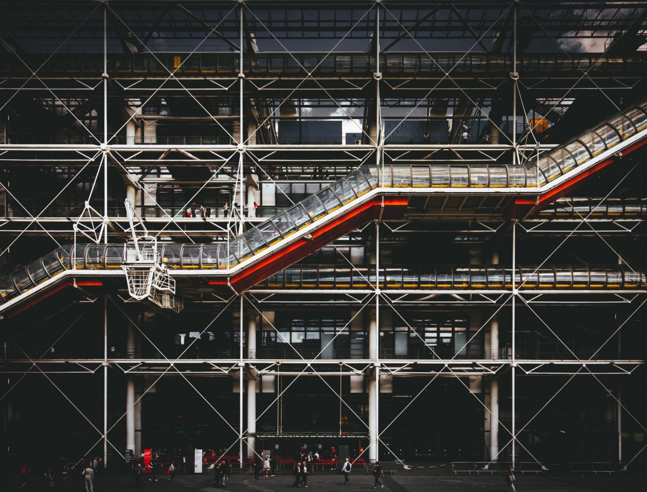 a high-tech building in paris with external escalators, the exterior of the Pompidou Center