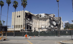 building demolition with palm trees