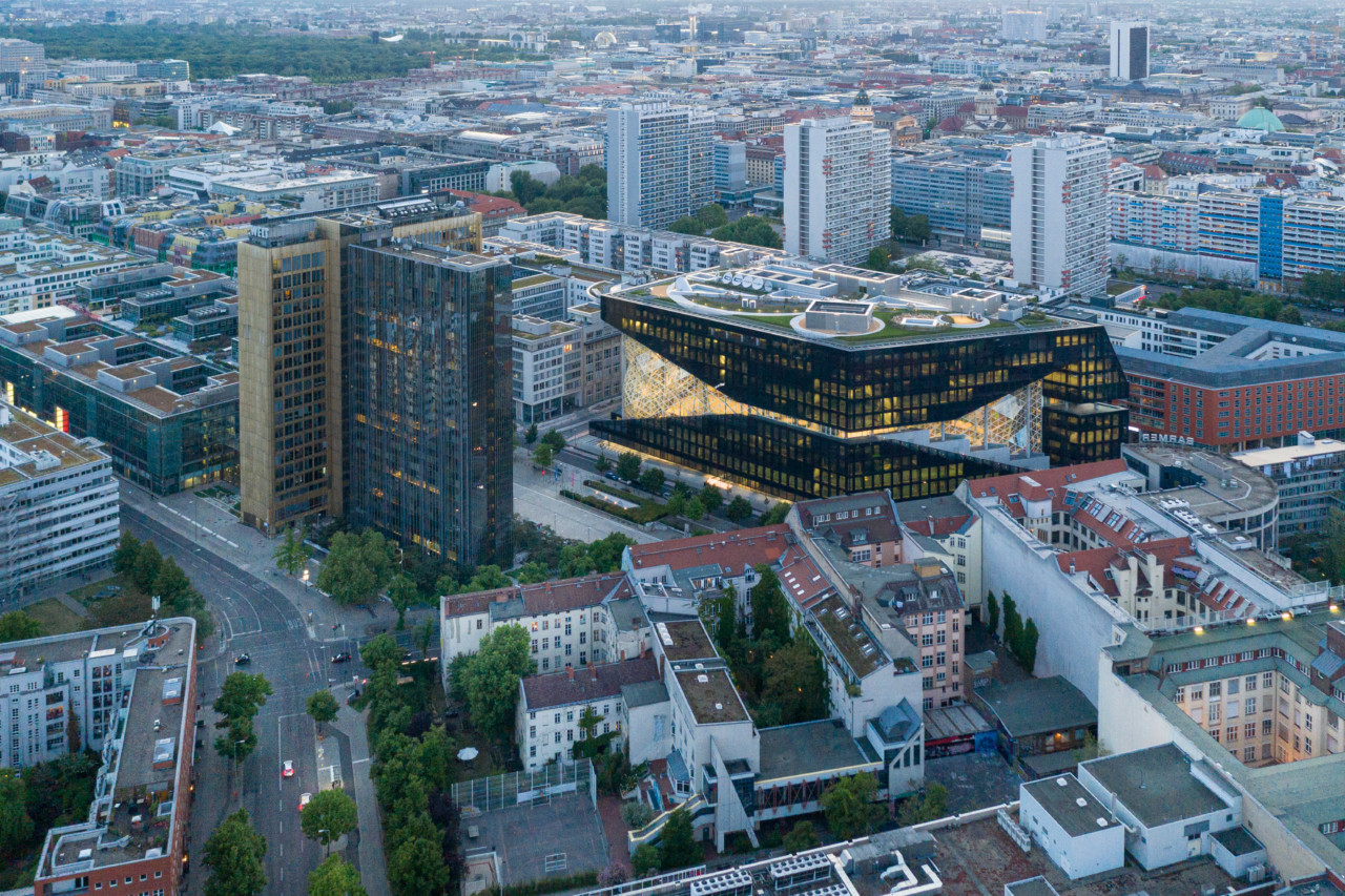 Aerial image of a bisected black office building