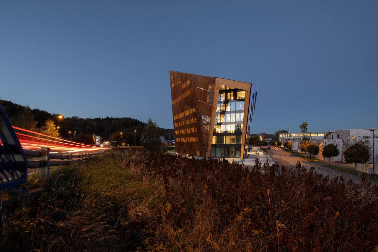 Looking at an angular, screen-clad office building