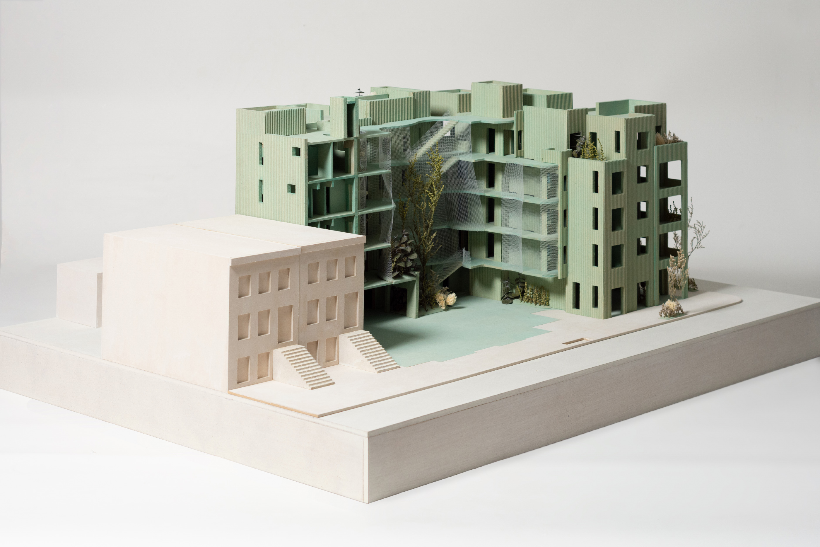 Model of an apartment building with large exposed courtyard