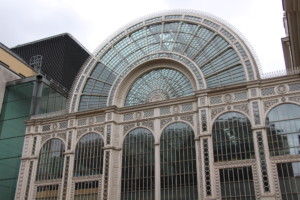 exterior of a famous london venue with arched glass entrance