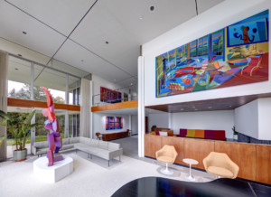 Interior of a modernist home splashed with paintings for virtual window