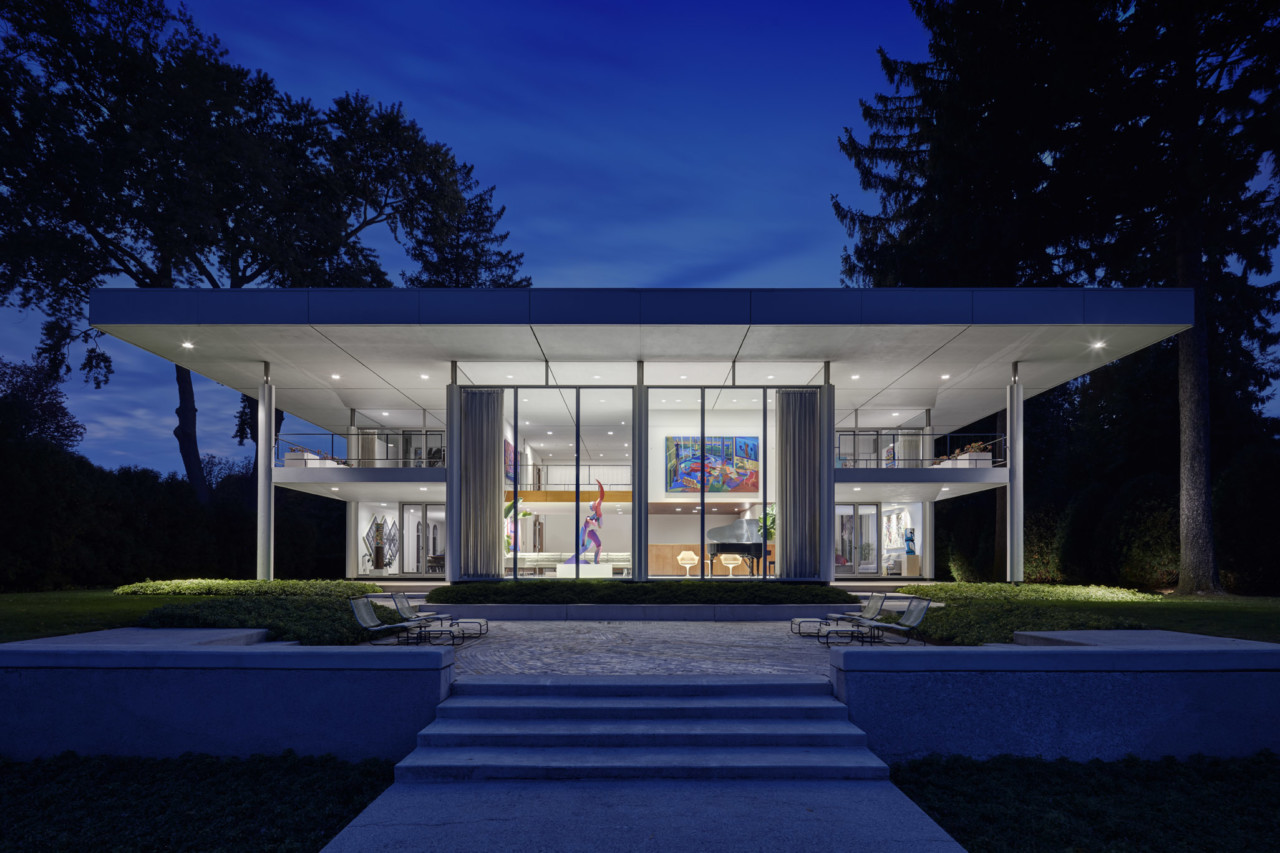 view of modernist home at night