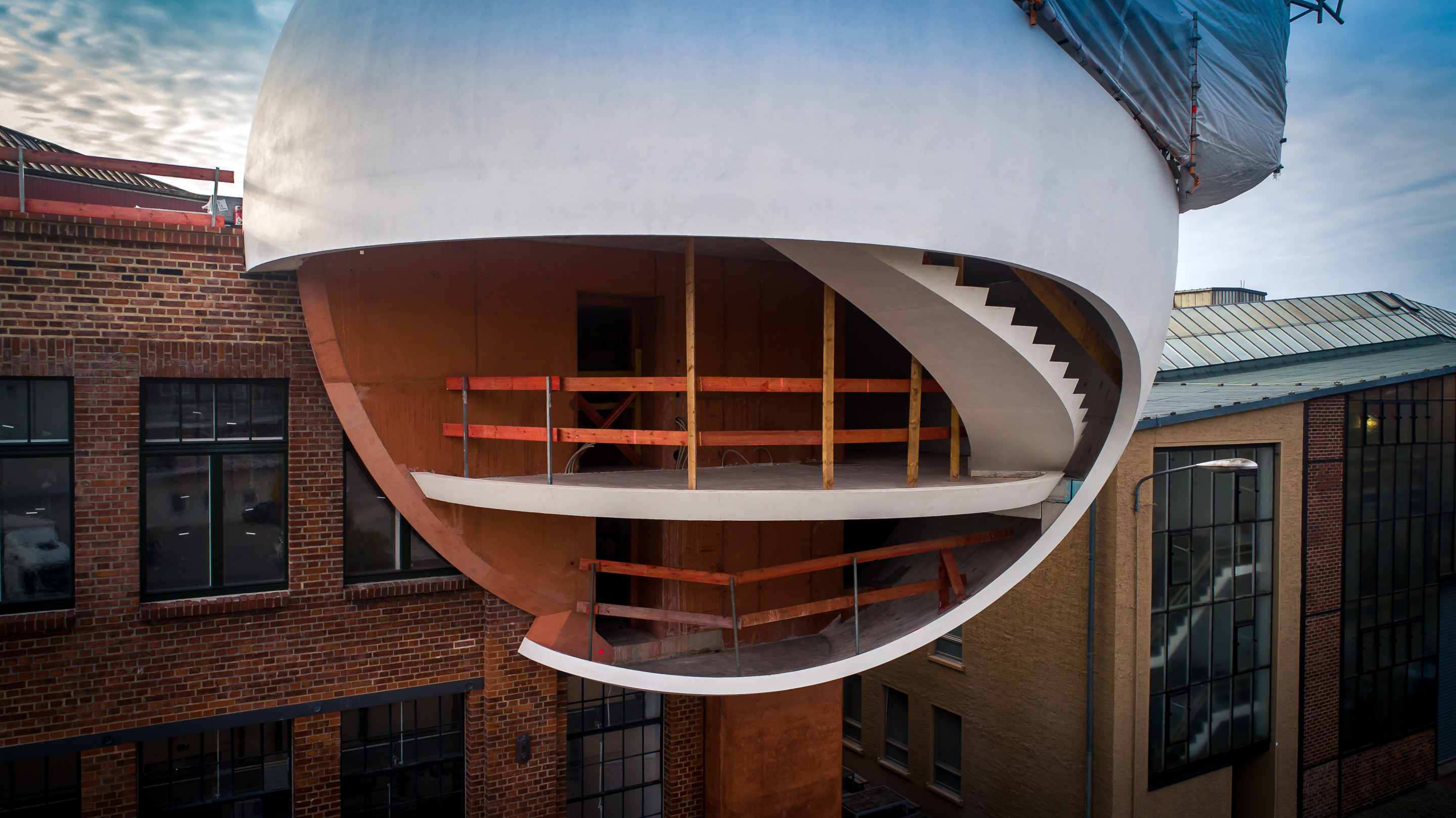 a spherical addition to a building under construction
