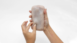 Pinching a fleshy phone case, art from virtual exhibitions