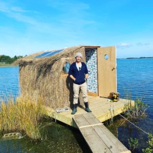 Artist Scott Bluedorn and his floating dwelling bonac blind