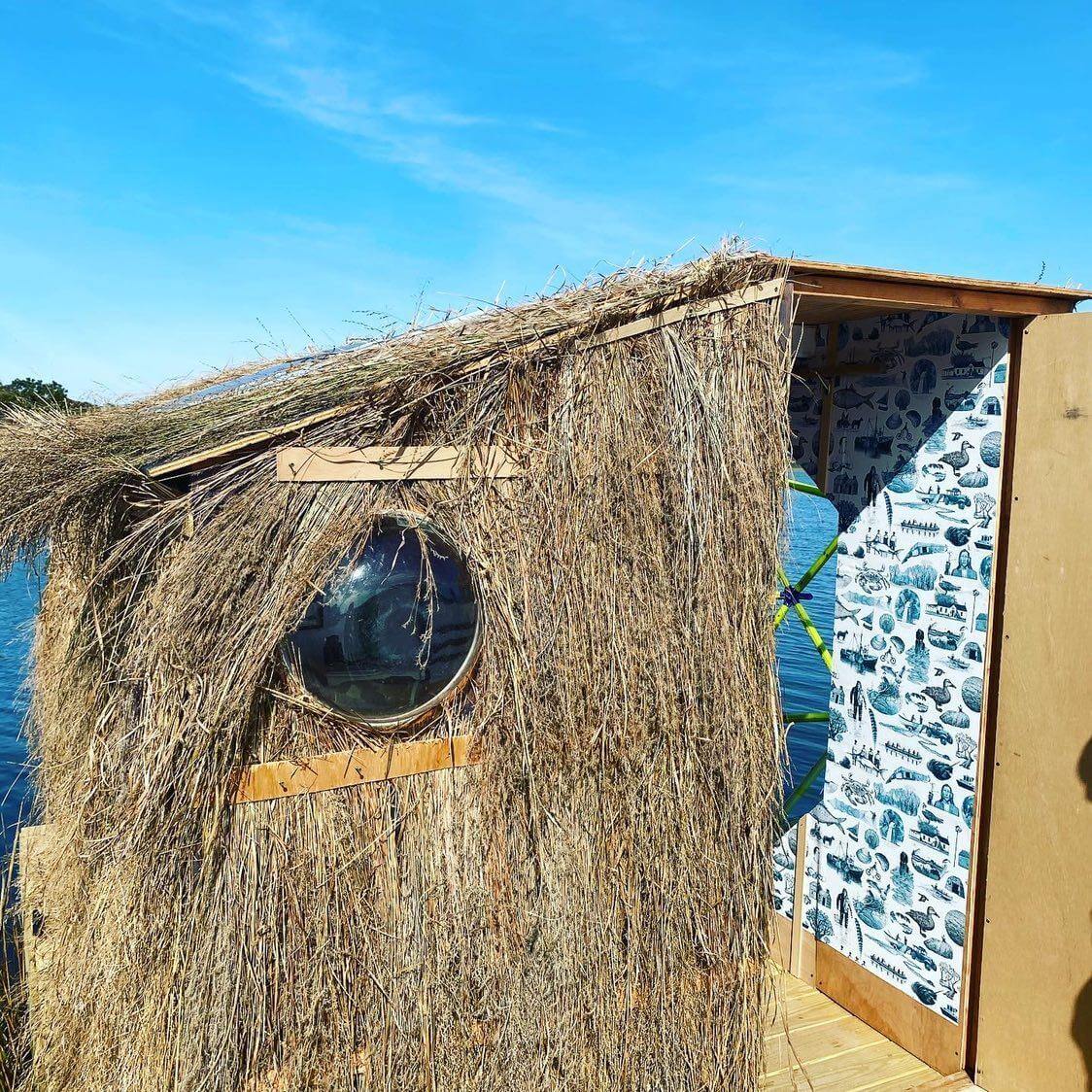 a reed-covered floating dwelling; bonac blind