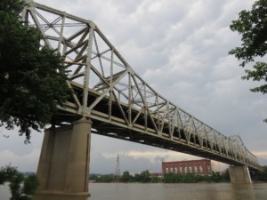 a double-decker truss bridge crossing a river