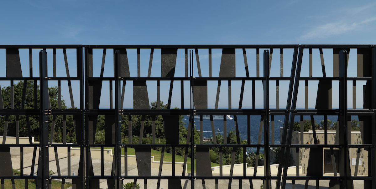 A perforated gate looking out over capri
