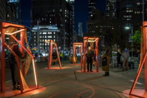 design installation in manhattan pictured at night made of red metal frames