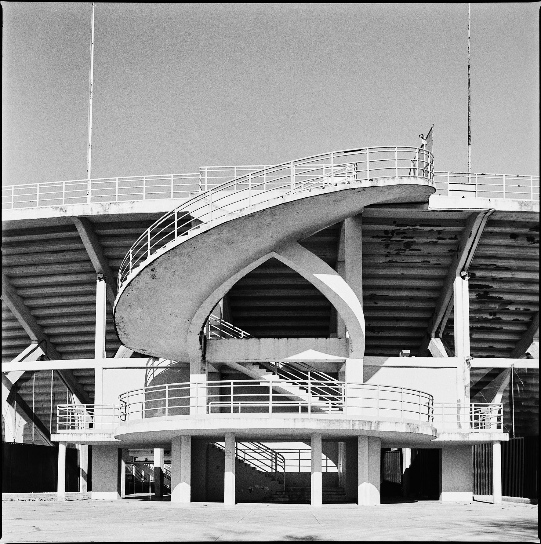 black and white photo of a staircase at a landmark italian football stadium