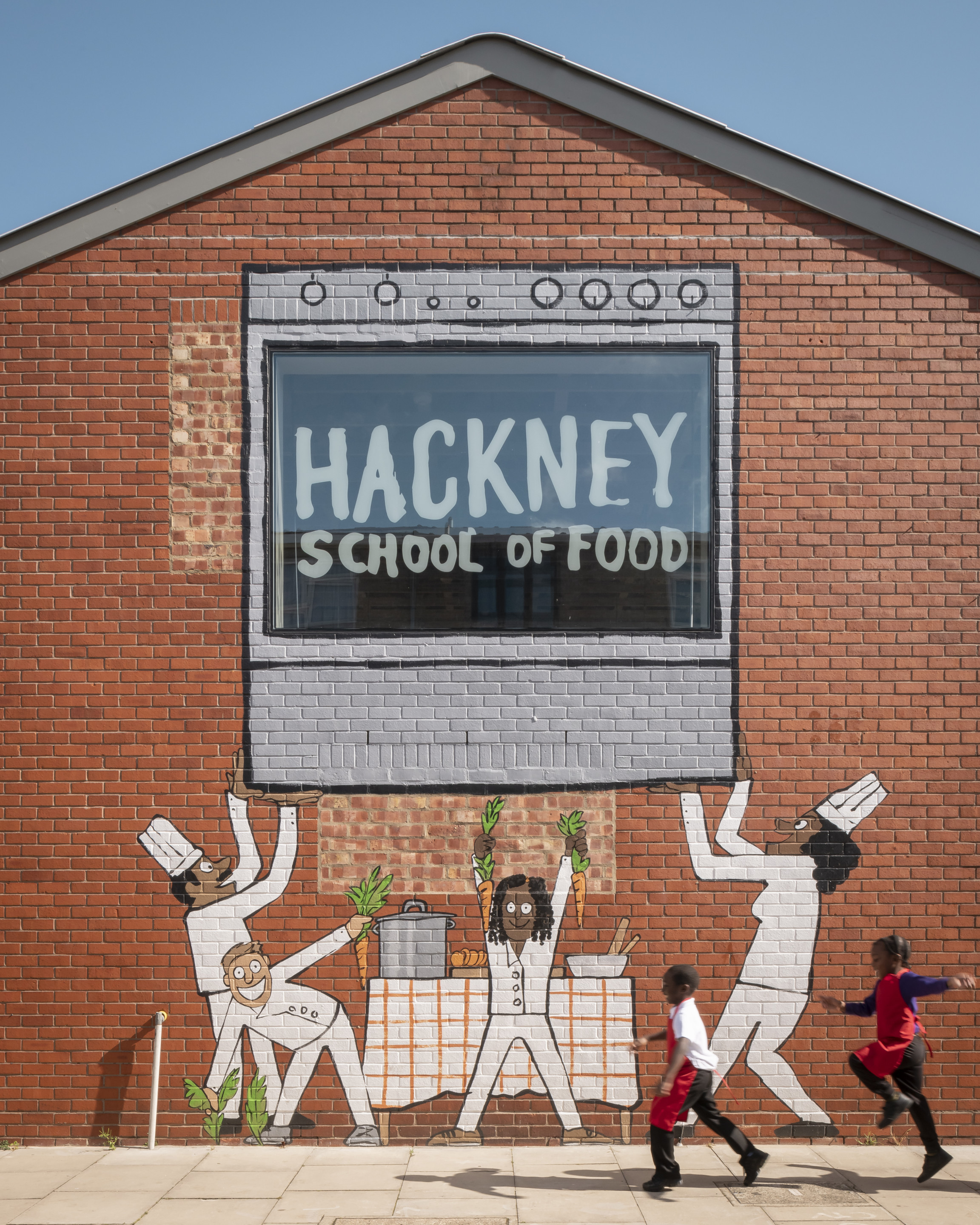 A mural that reads hackney school of food