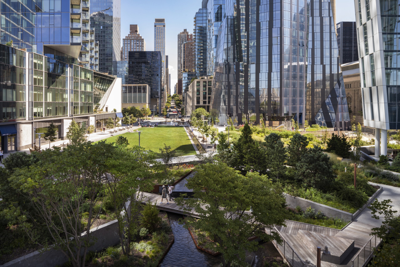 view of a city park surrounded by tall glass towers