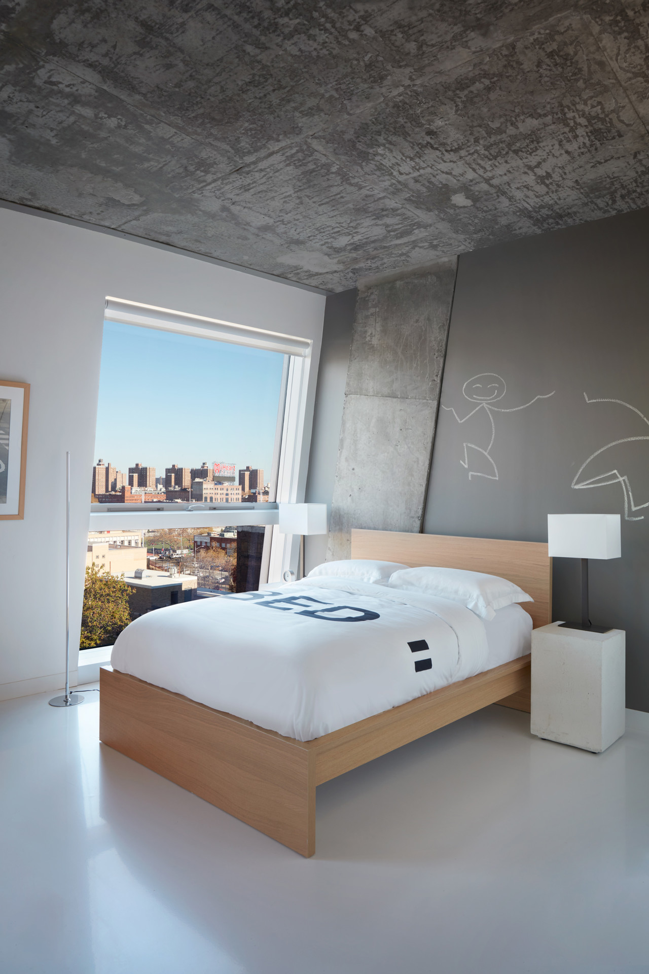 Interior of a bedroom with concrete ceilings