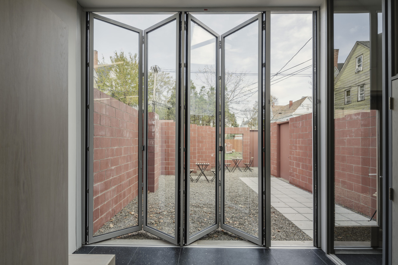 A sliding glass door leading to a patio, new addition from Davidson Rafailidis
