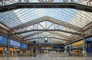 inside a glass ceiling at the new penn station platfoirm