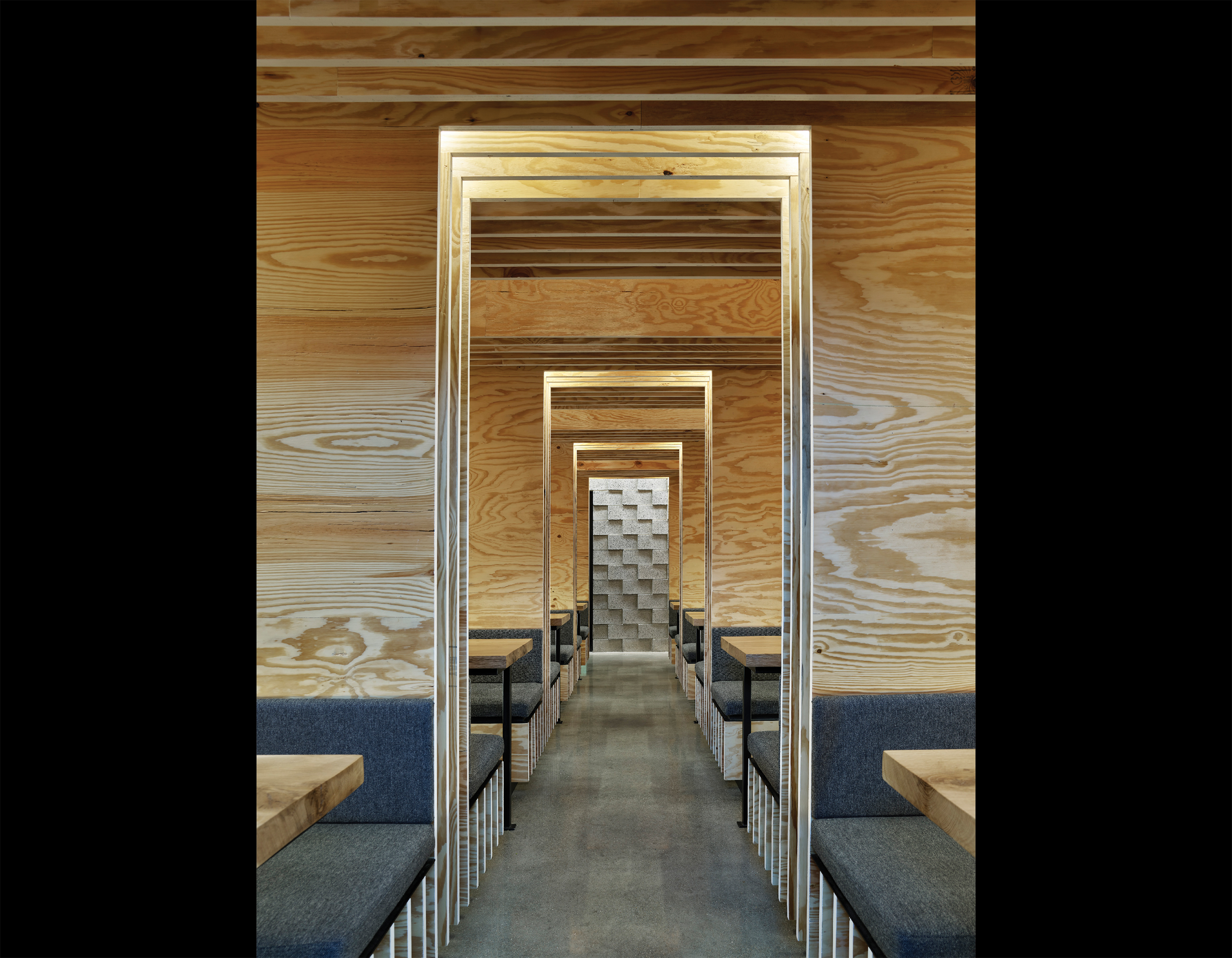 Interior of a ramen restaurant decked out in plywood