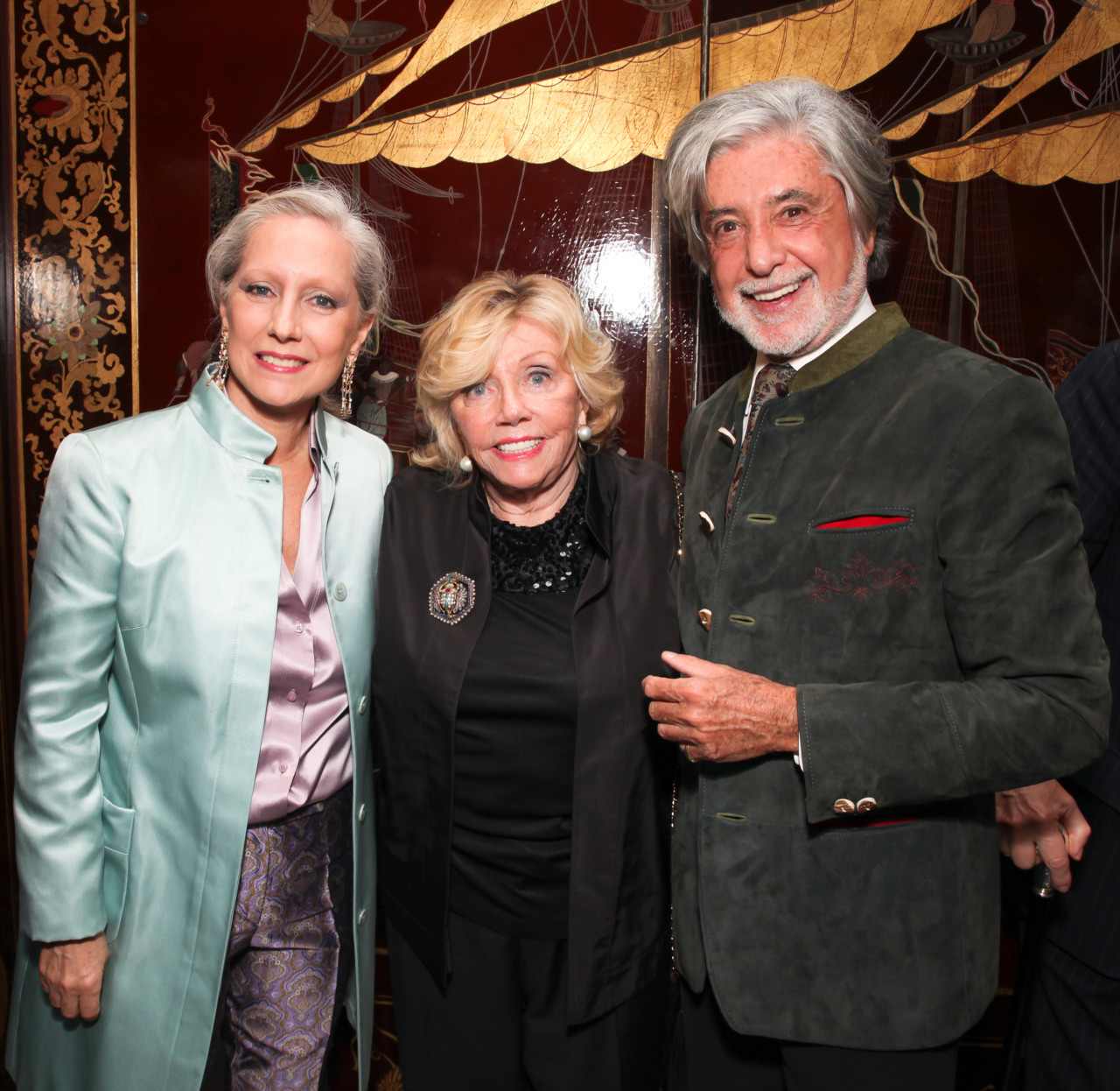 paige rense, center, an older woman at a cocktail party