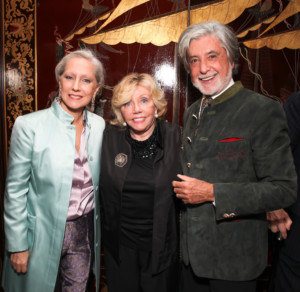paige rense, center, an older woman at a cocktail party