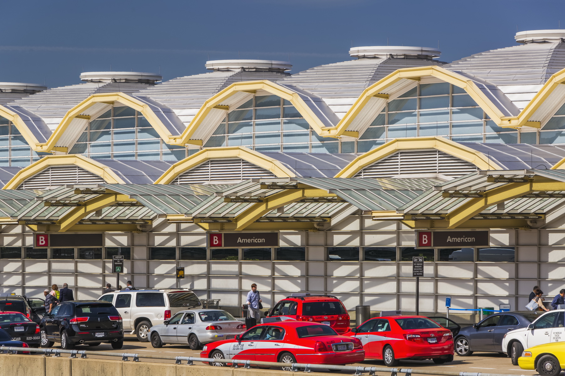 exterior of an airport with domes on the facade