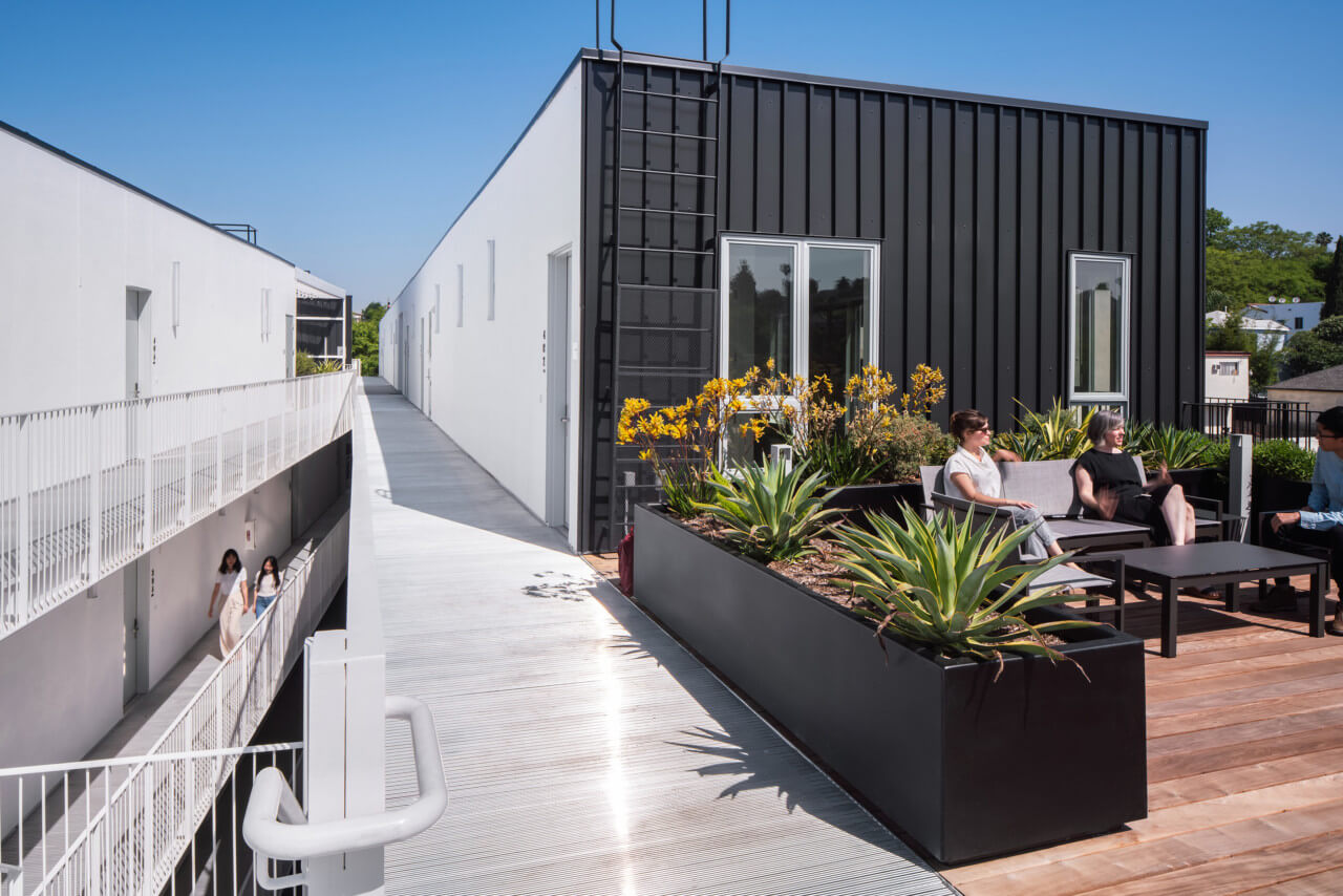 Rooftop lounge on a blackened facade building
